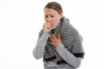 Stock image of coughing woman