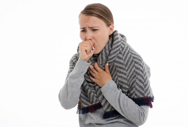 Stock image of coughing woman