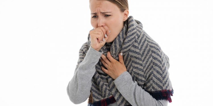 Stock image of coughing woman